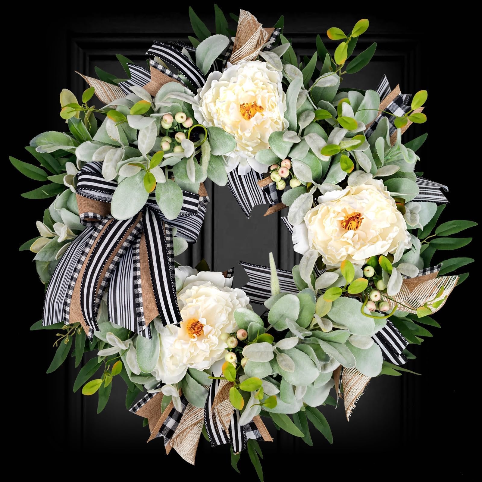 Artificial lamb's ear wreath with white peonies, berries, and buffalo plaid bow against a black background.