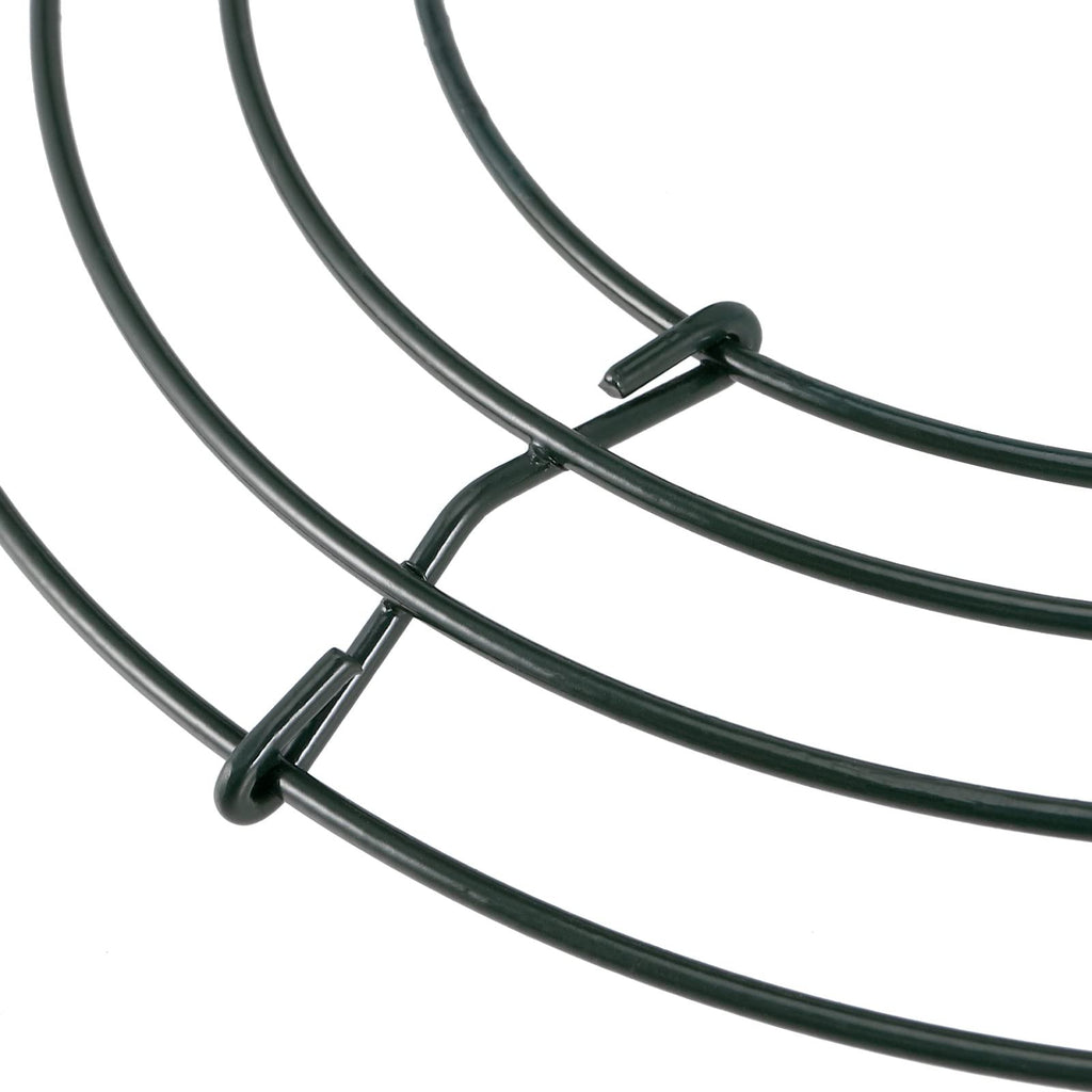 Close-up of green wire wreath frames showing construction details on a white background.