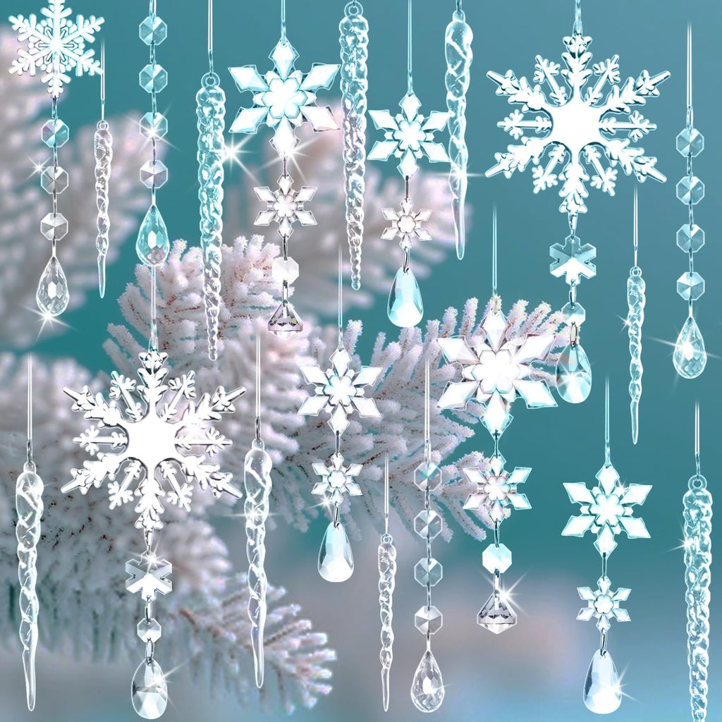 Assortment of clear acrylic snowflake, icicle, and drop ornaments hanging against a frosted branch background.