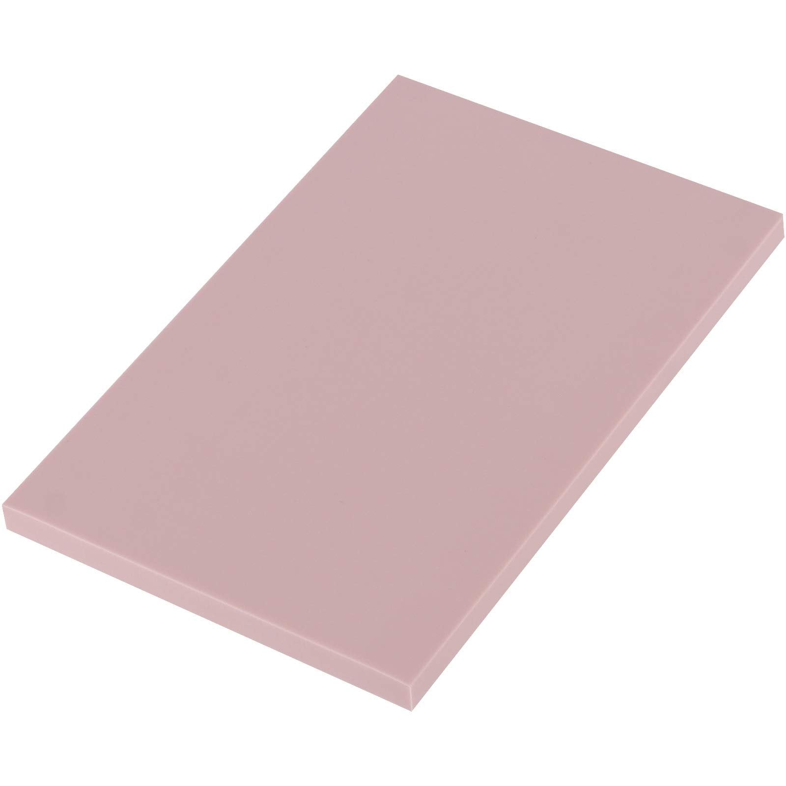 Single pink carving block for stamp making, shown at an angle on a white background.