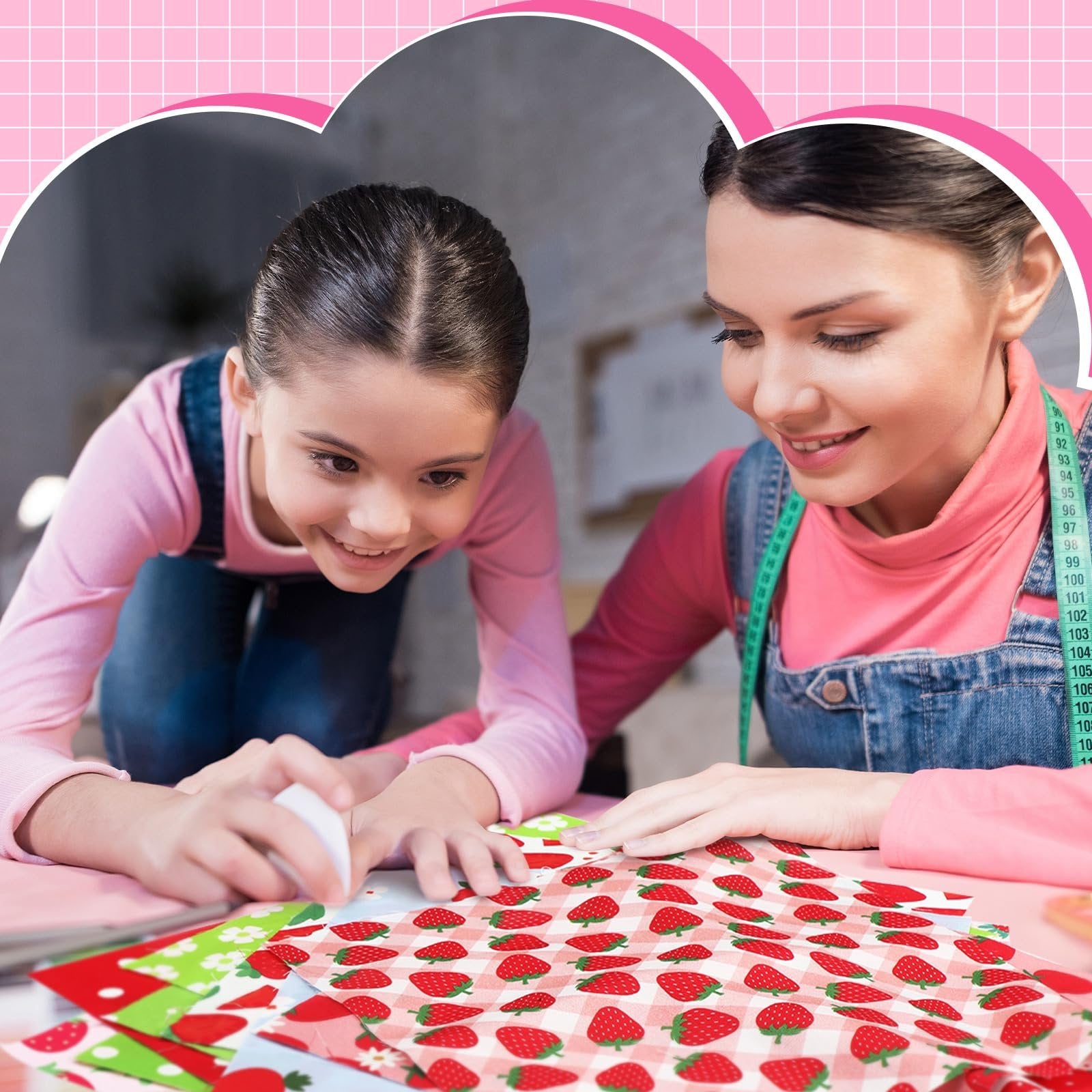 Mother and daughter crafting with strawberry patterned fabric squares