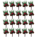 Twenty artificial pine picks with red berries and pinecones arranged in five rows on a white background.
