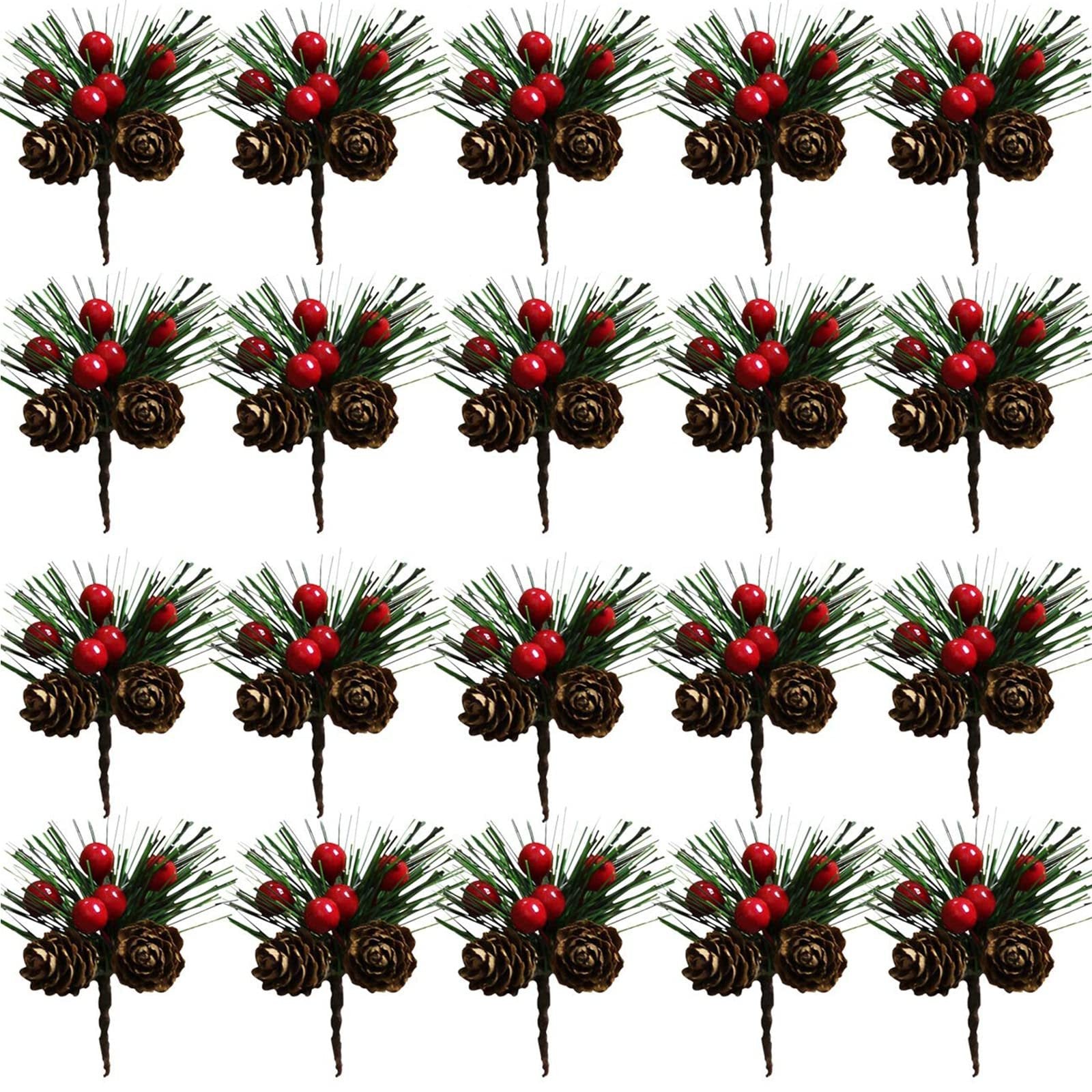 Multiple artificial pine picks with red berries and pinecones arranged in a grid on a white background.