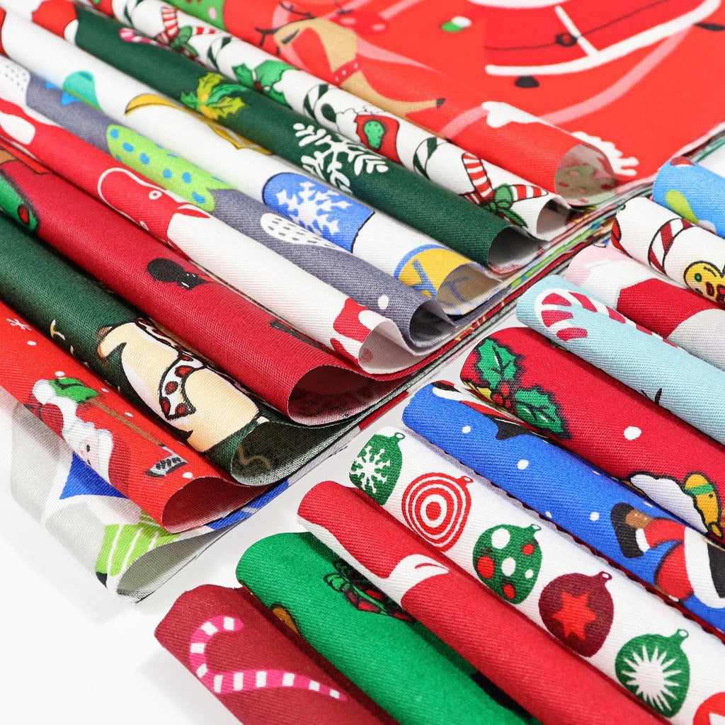 Rolled Christmas fabric squares with holiday patterns like Santa, snowflakes, and ornaments, arranged in a stack.