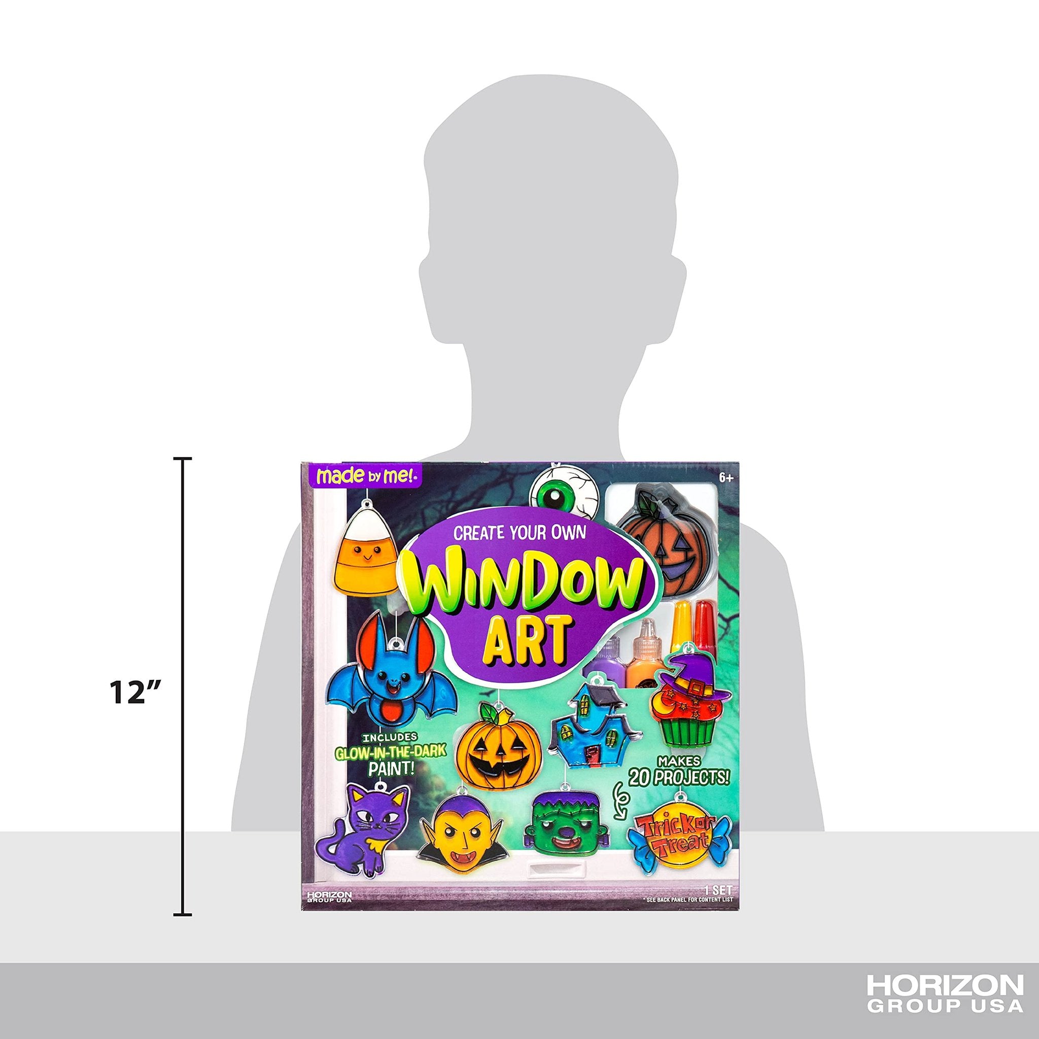 Halloween window art kit box showing various Halloween characters and paint tubes, with a 12-inch measurement scale.