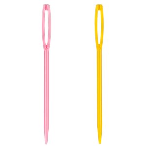 Two large plastic sewing needles, one pink and one yellow, on a white background.