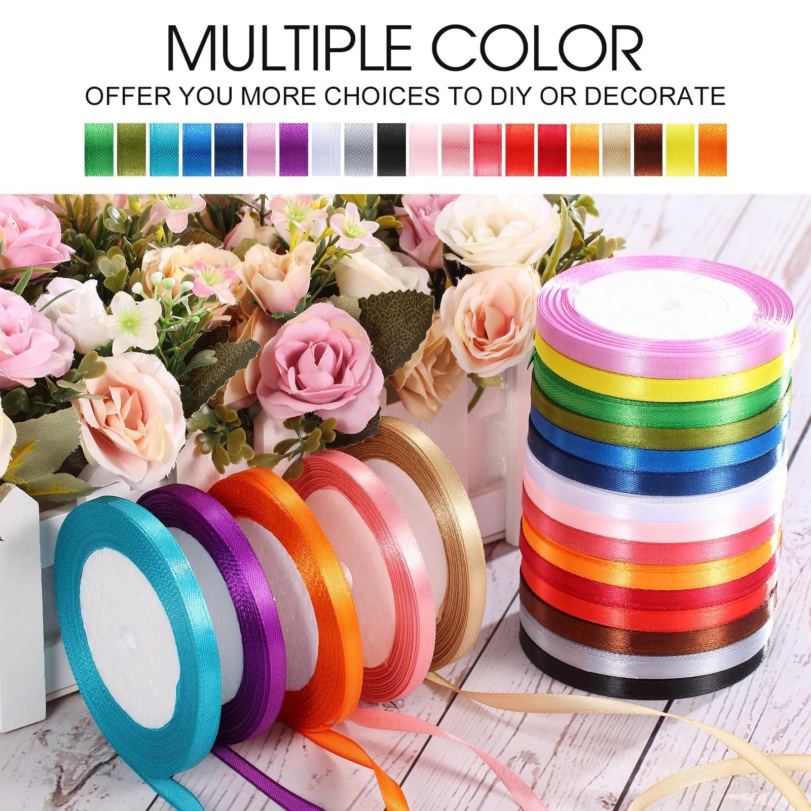 Assortment of 20 colorful satin ribbon rolls arranged with artificial flowers, showing multiple colors and textures.