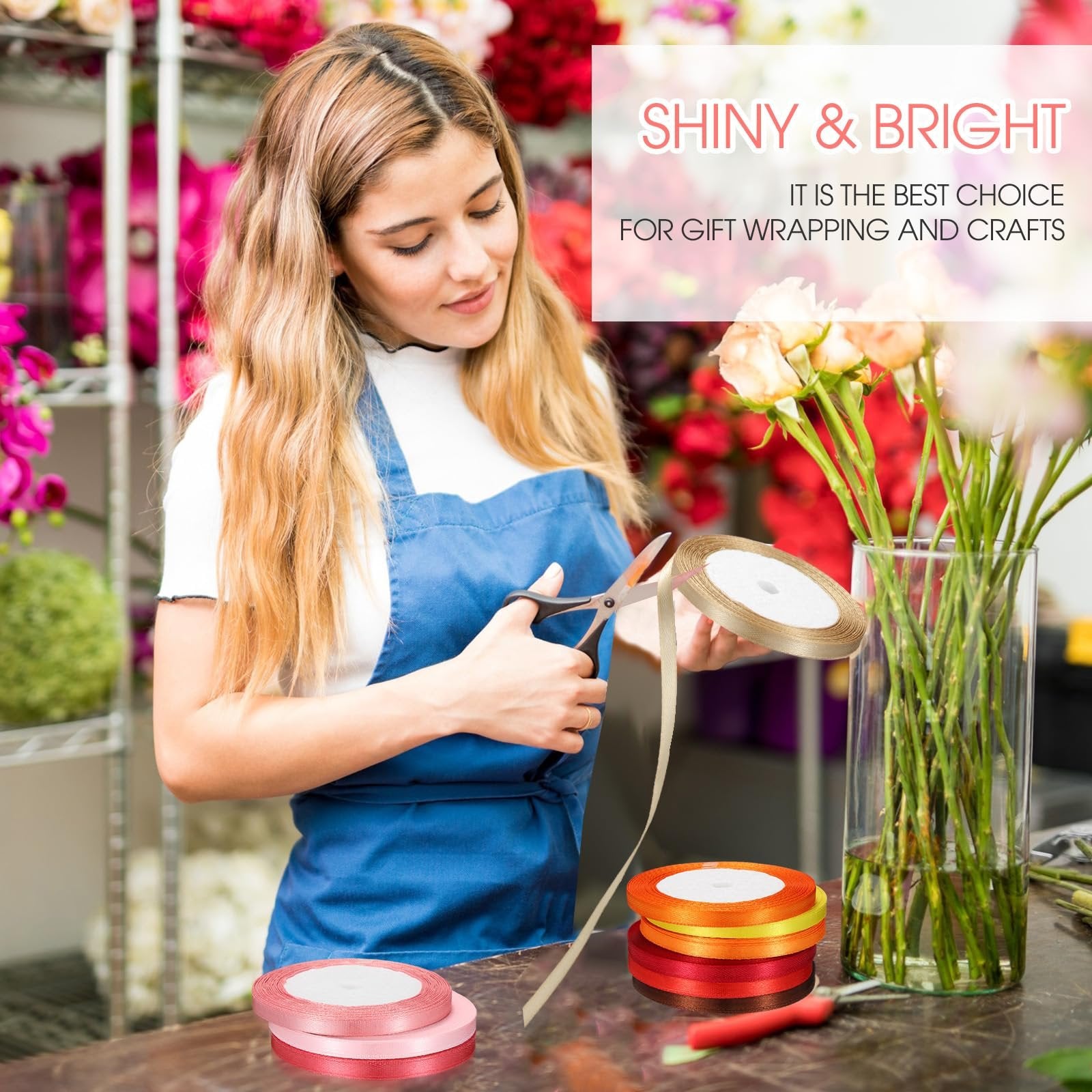 Woman in blue apron cutting rainbow satin ribbon rolls for crafts and gift wrapping