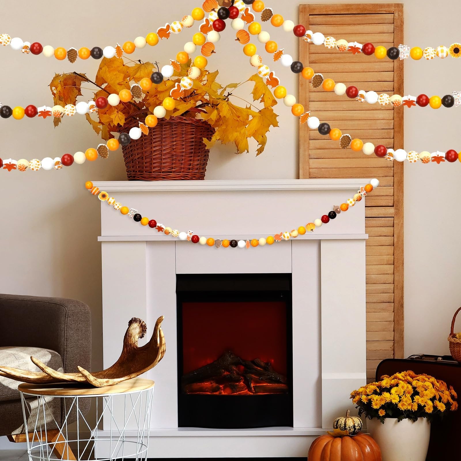 Thanksgiving beaded garlands with maple leaves, pumpkins, and plaid patterns draped over a fireplace mantel.