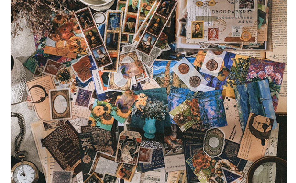 Scrapbooking kit with vintage stickers, washi tape, and decorative papers featuring art prints and stamps.