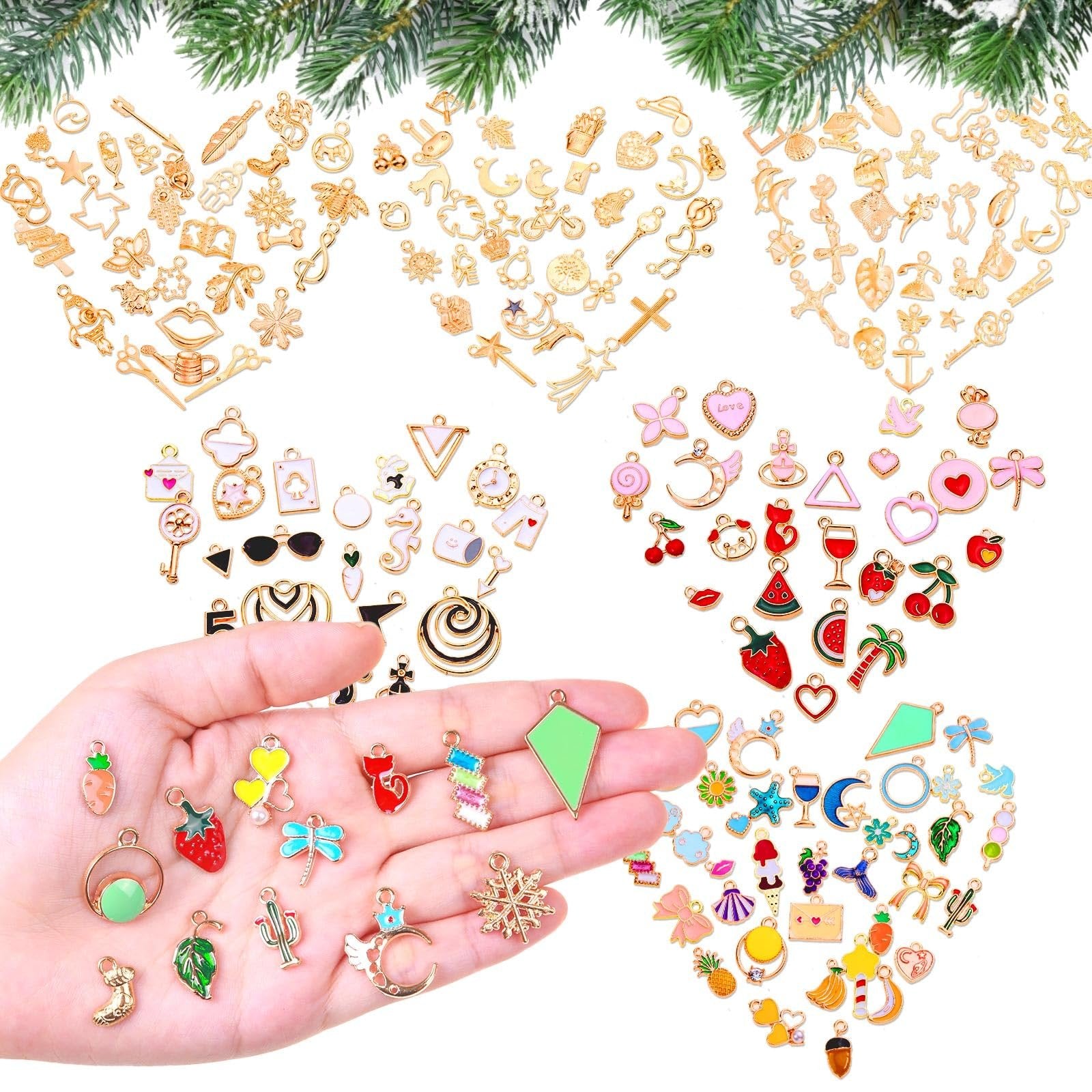 Hand holding various colorful enamel and gold jewelry charms, with more charms arranged in heart shapes above.
