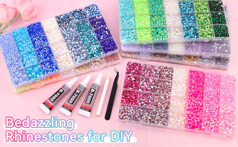 Assorted colorful rhinestones in organizer boxes with B-7000 glue tubes, tweezers, and pickup pen.