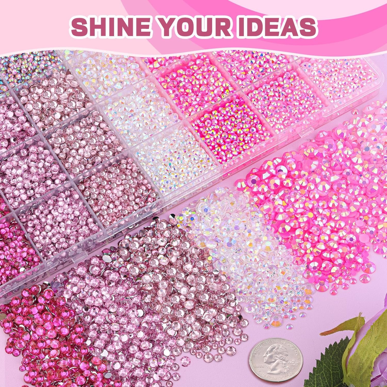 Assortment of pink and iridescent resin rhinestones in a clear organizer tray and scattered, with a quarter for scale.