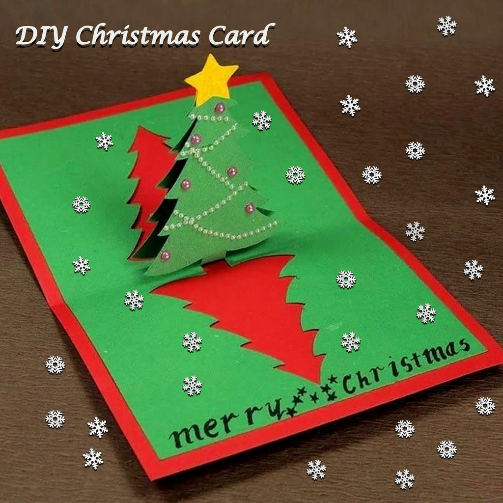 DIY Christmas card with pop-up tree and snowflakes, text reads 'Merry Christmas'