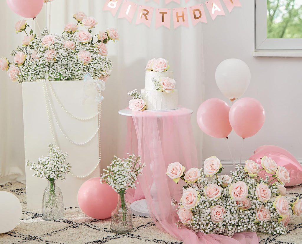 Birthday party scene with pink roses, baby's breath flowers, balloons, and a cake.