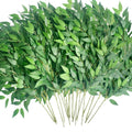 Bundle of artificial Italian Ruscus greenery stems with green silk leaves on white background