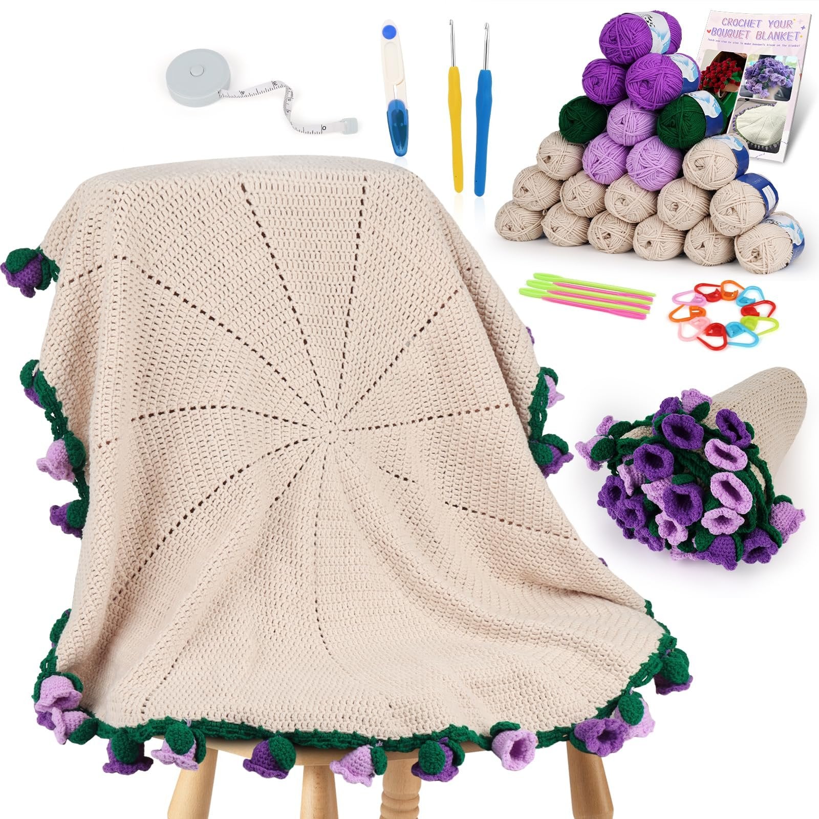 Crochet blanket kit with yarn balls, crochet hooks, tape measure, stitch markers, needles, scissors, and a crocheted flower bouquet.