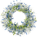 Artificial daisy and wildflower wreath with eucalyptus leaves on a white background