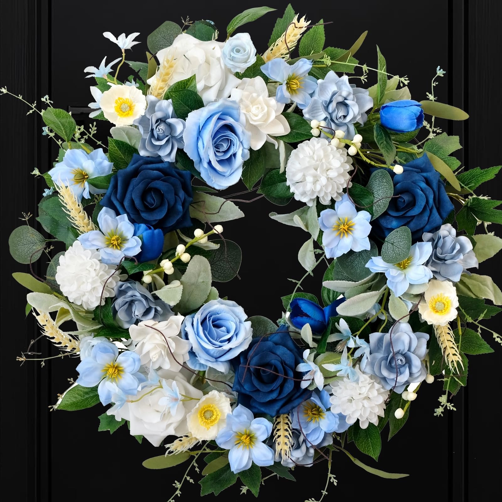 Blue and white artificial floral wreath with roses, dahlias, and hydrangeas on a black background.