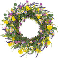 22 inch artificial spring wreath with daisies, lavender, jasmine, and wildflowers on a grapevine base, shown from the front.