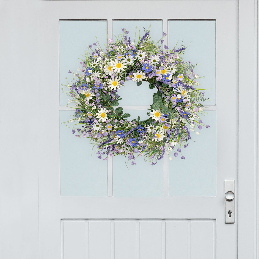 22-inch blue summer wreath with daisies, lavender, wildflowers, and eucalyptus hanging on a white door.