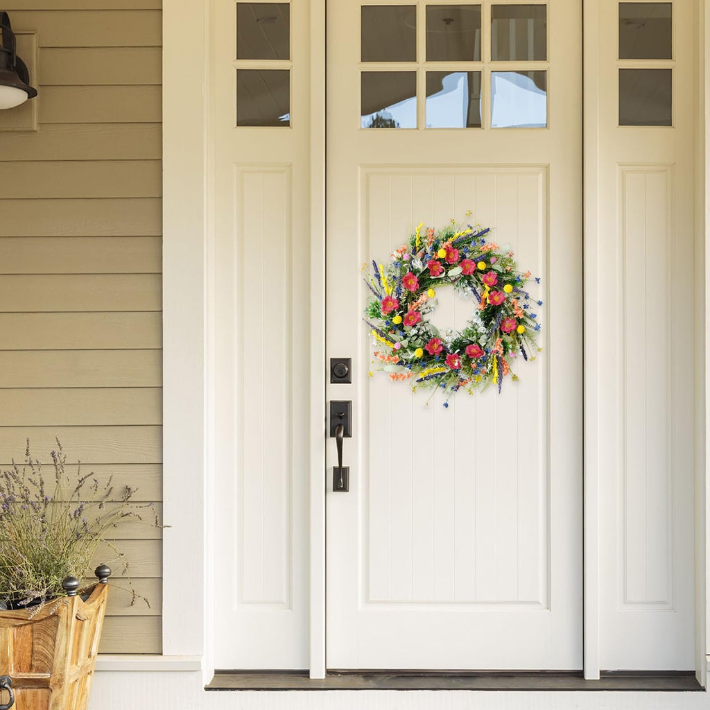 22-inch artificial wildflower and lavender wreath hanging on a white front door.