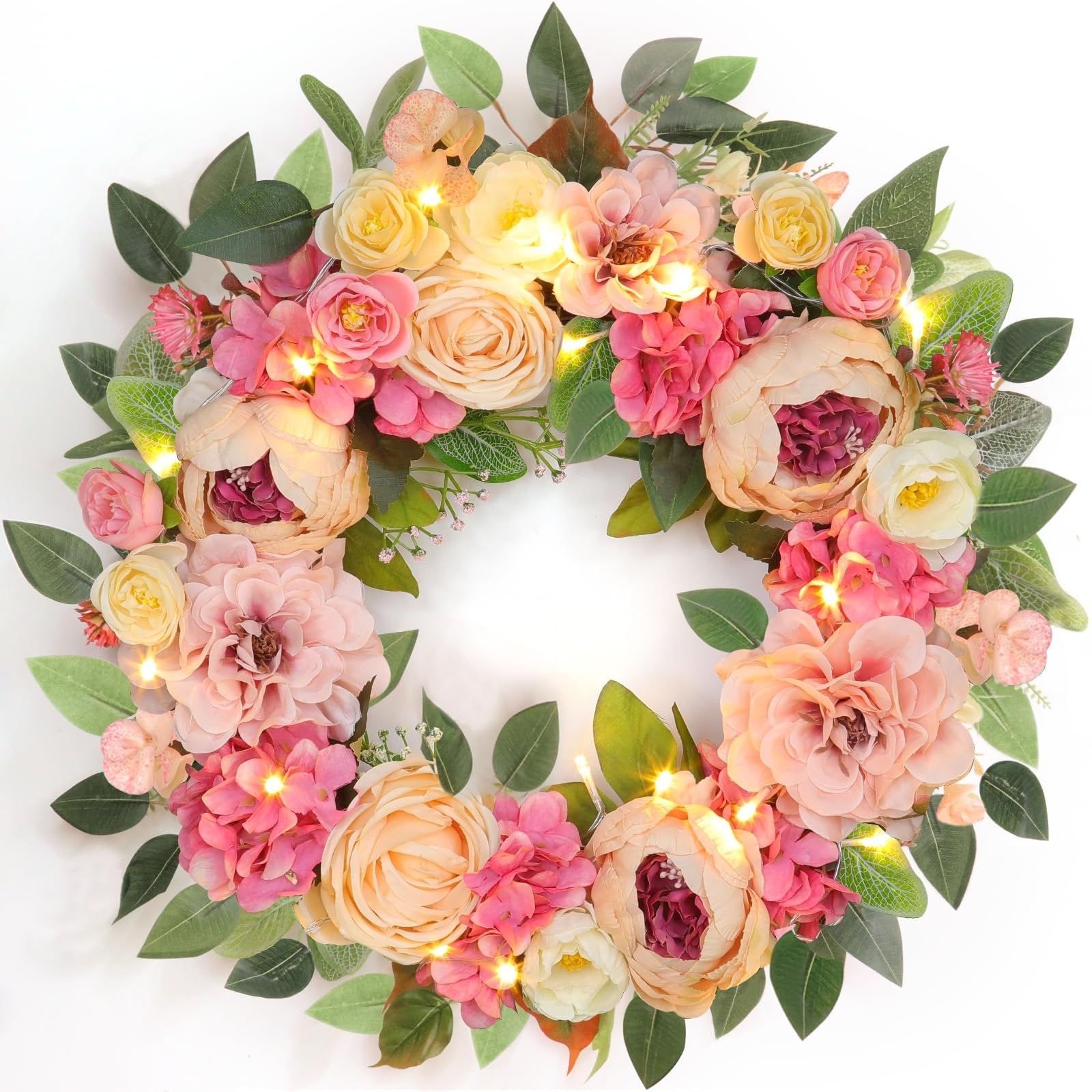 Lighted floral wreath with pink and cream peonies, roses, and hydrangeas on a white background