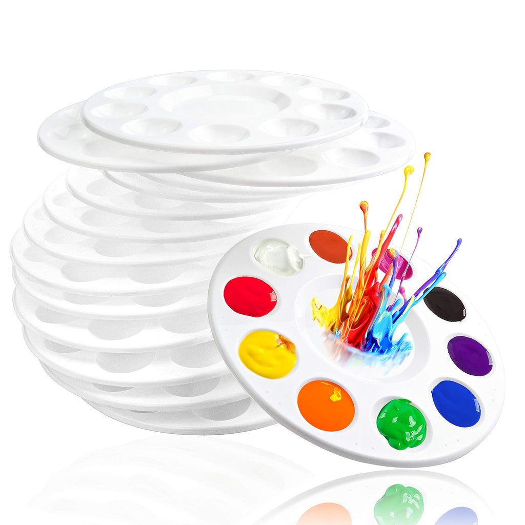 Stack of white plastic paint palettes with colorful paint splashing from the top one, 10 wells each.