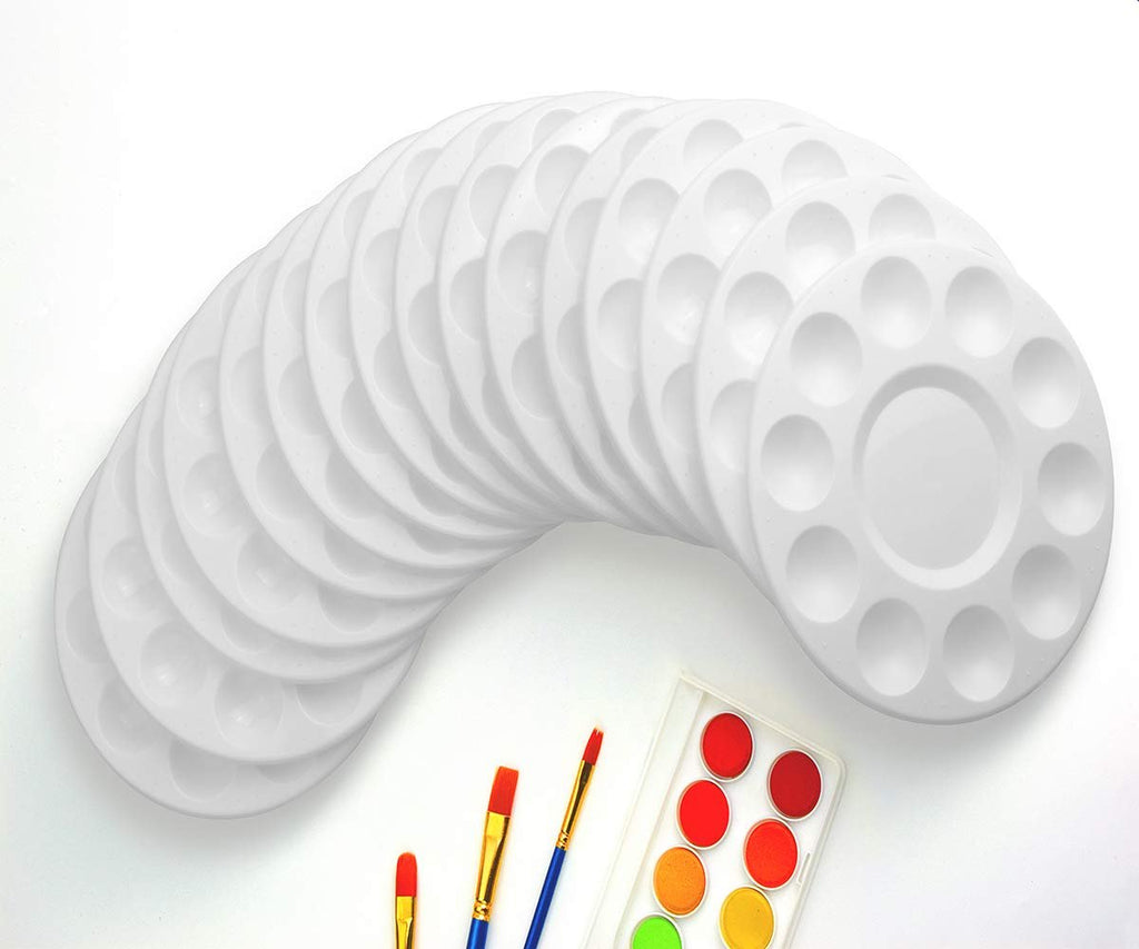Stack of 22 white plastic paint palettes with 10 wells each, shown with paintbrushes and a watercolor paint set.