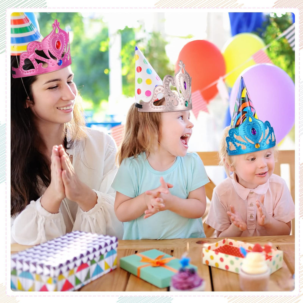 Woman and two children wearing princess crowns and party hats at a table with gifts and cupcakes.