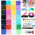 Assorted colorful resin rhinestones in a divided container with glue, tweezers, and pickup pen.