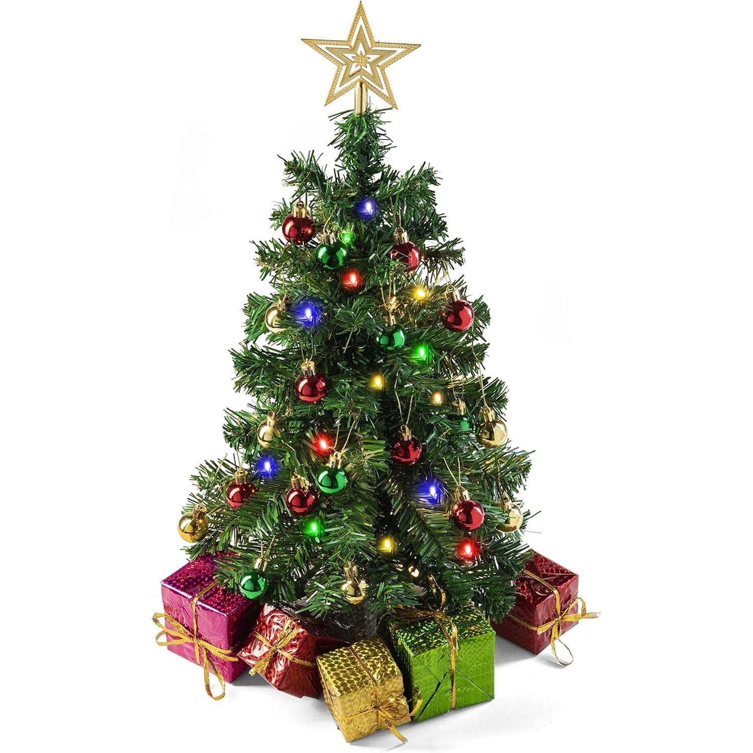 Miniature Christmas tree with multicolor LED lights, ornaments, star topper, and gift boxes at its base, isolated on white.