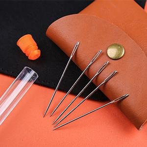 Set of stainless steel hand sewing needles with large eyes, a thimble, and a storage bottle.