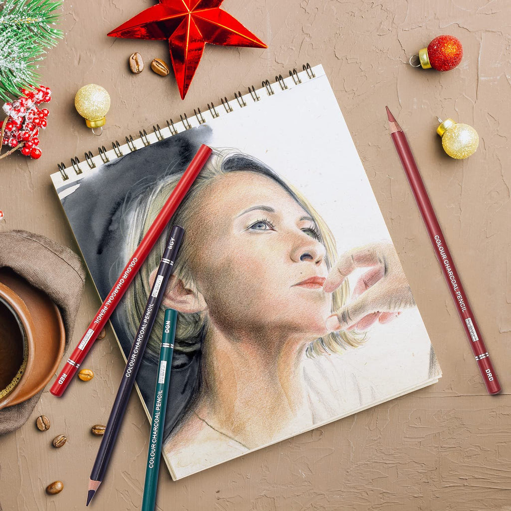 Drawing of a woman's face with charcoal pencils and coffee on a textured surface with Christmas decorations