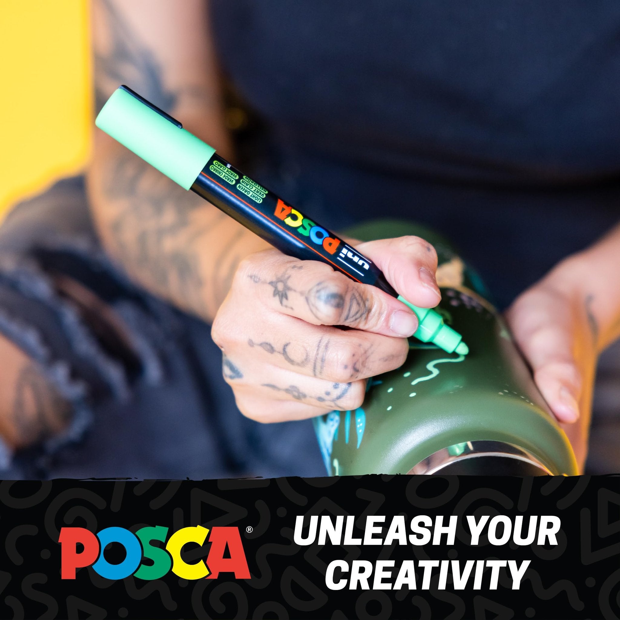Person using a light green marker to draw on a green water bottle, with a black and colorful logo and text overlay.