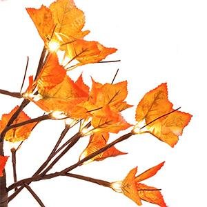 Close-up of a 24-inch artificial lighted maple tree with orange-red leaves and 24 LED lights, against a white background.