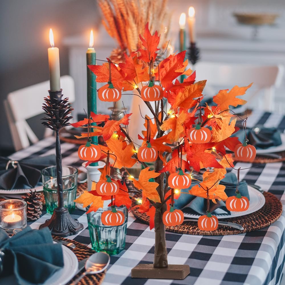 Lighted maple leaves tree with 24 LEDs and 12 wood pumpkin ornaments on a table setting.
