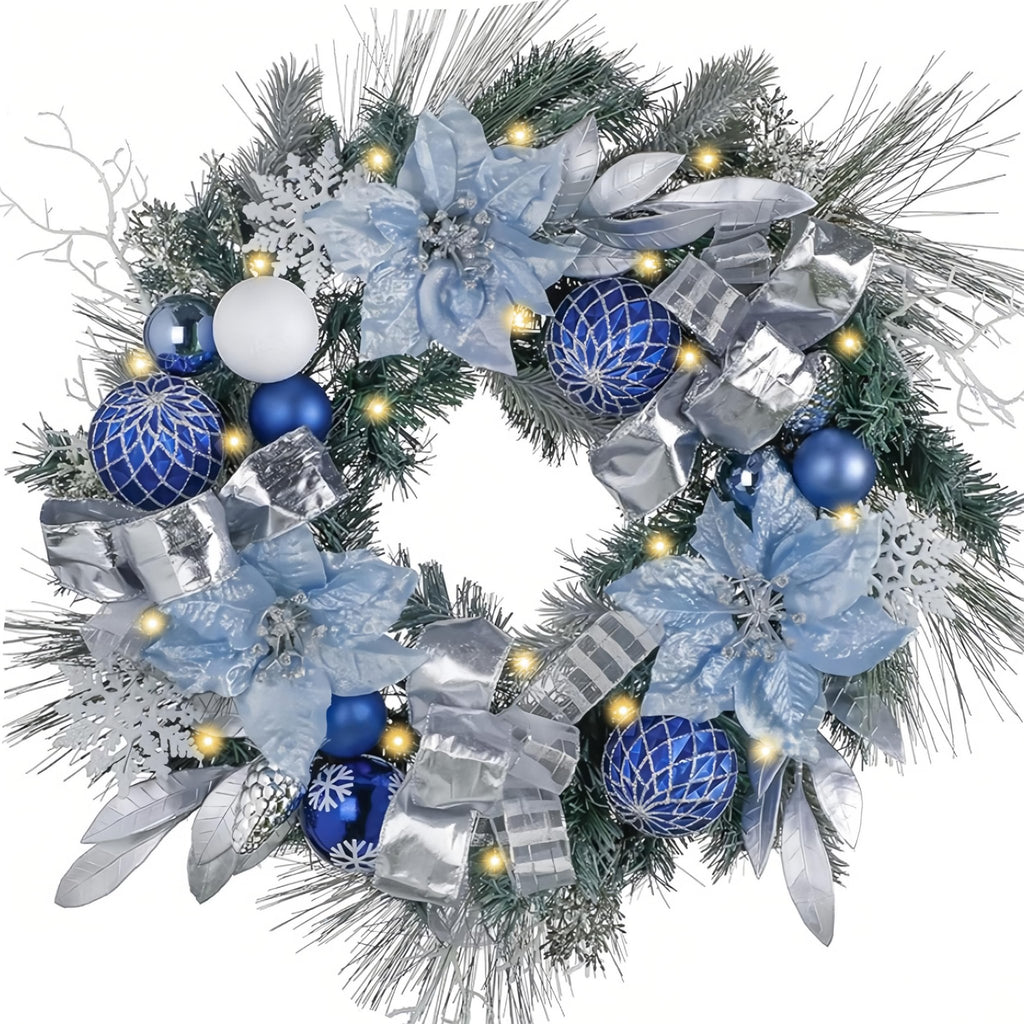 Silver and blue Christmas wreath with ornaments, poinsettias, and lights on a white background