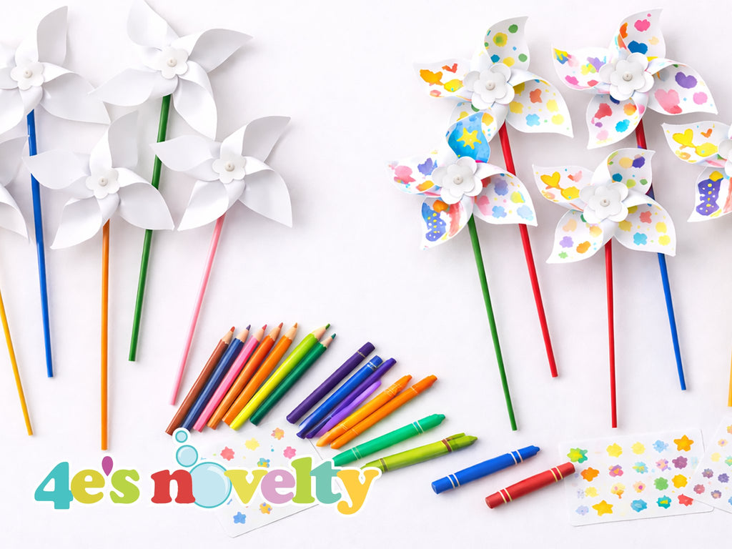 DIY pinwheel craft kit with colored pencils, crayons, and stickers on a white background.