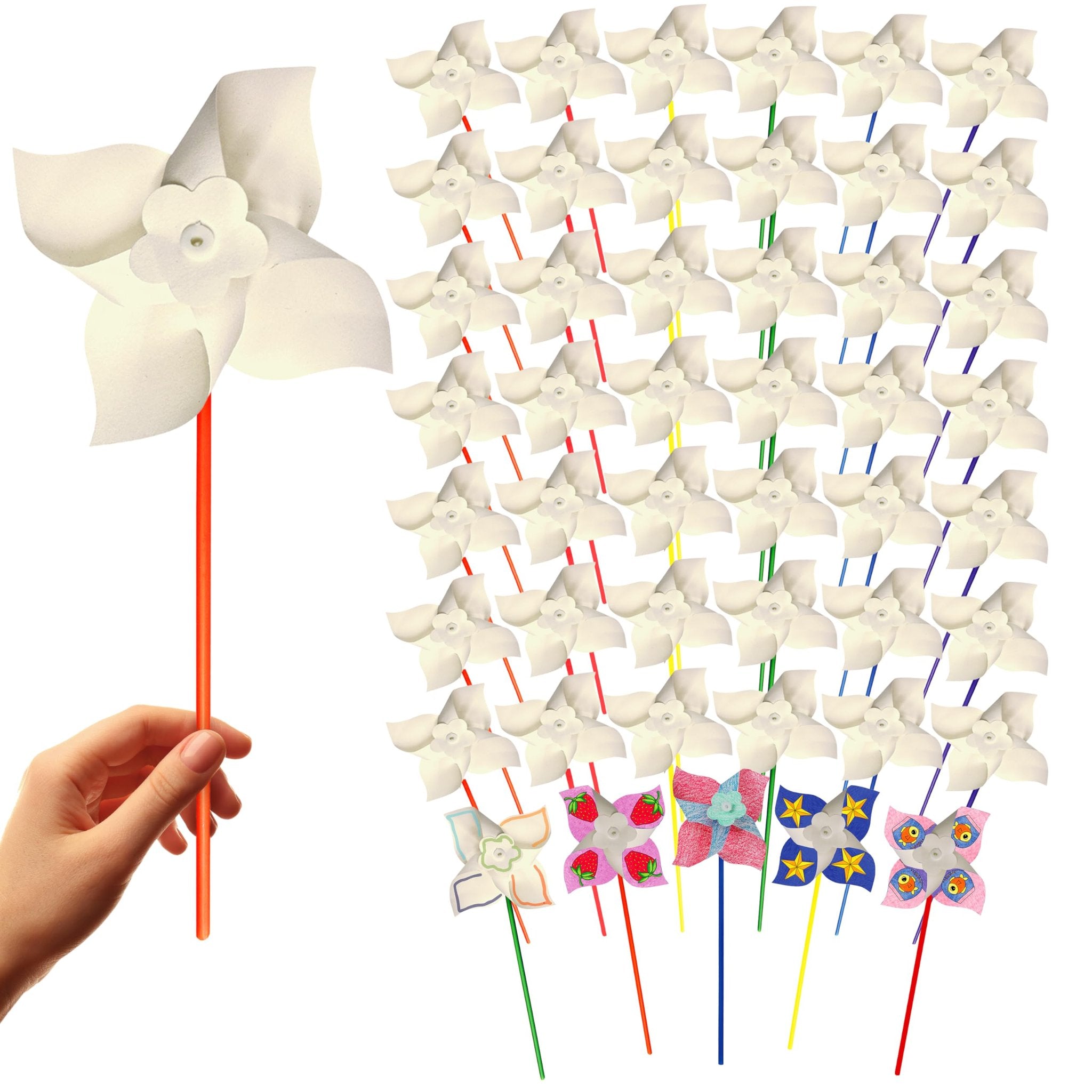 Hand holding a white pinwheel on an orange stick, with a large group of white pinwheels behind it.