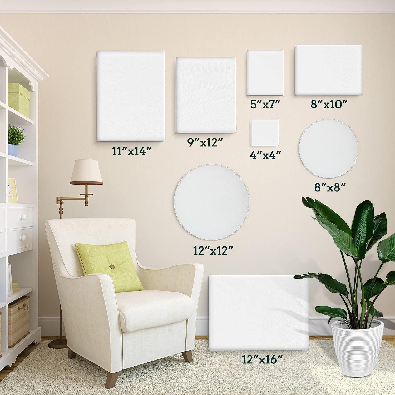 Various sizes and shapes of white stretched painting canvases displayed on a wall above a chair and next to a plant.