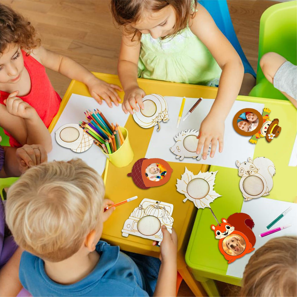 Children crafting unfinished wooden fall picture frame ornaments, including pumpkins, squirrels, and acorns.