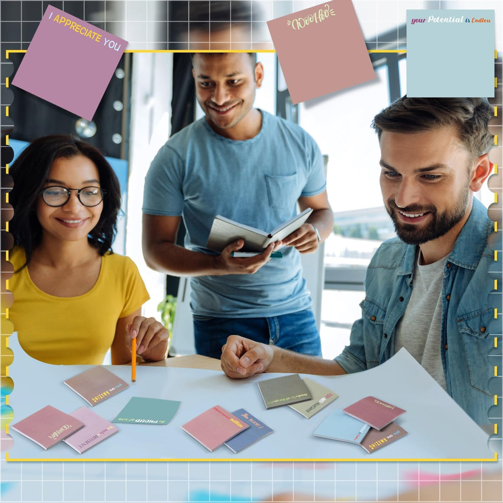 Three people gathered around a table with inspirational sticky notes, one woman in yellow shirt, one man in blue t-shirt, one man in denim shirt.