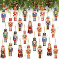 Diamond painting nutcracker keychains hanging from pine branches, showing various designs and colors.