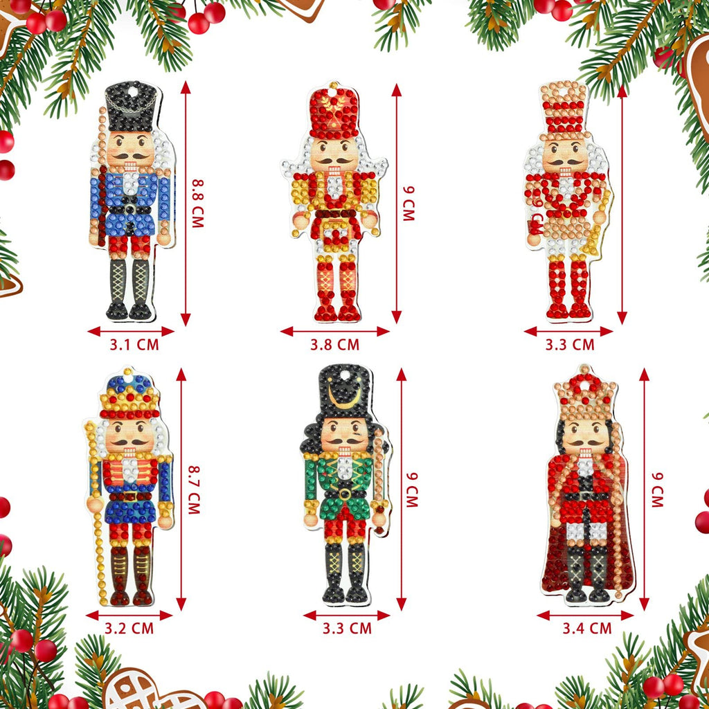 Six diamond painting nutcracker keychains shown with dimensions, surrounded by Christmas greenery and gingerbread.