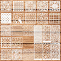Collection of 24 reusable geometric stencils with various patterns laid out on a wooden background.