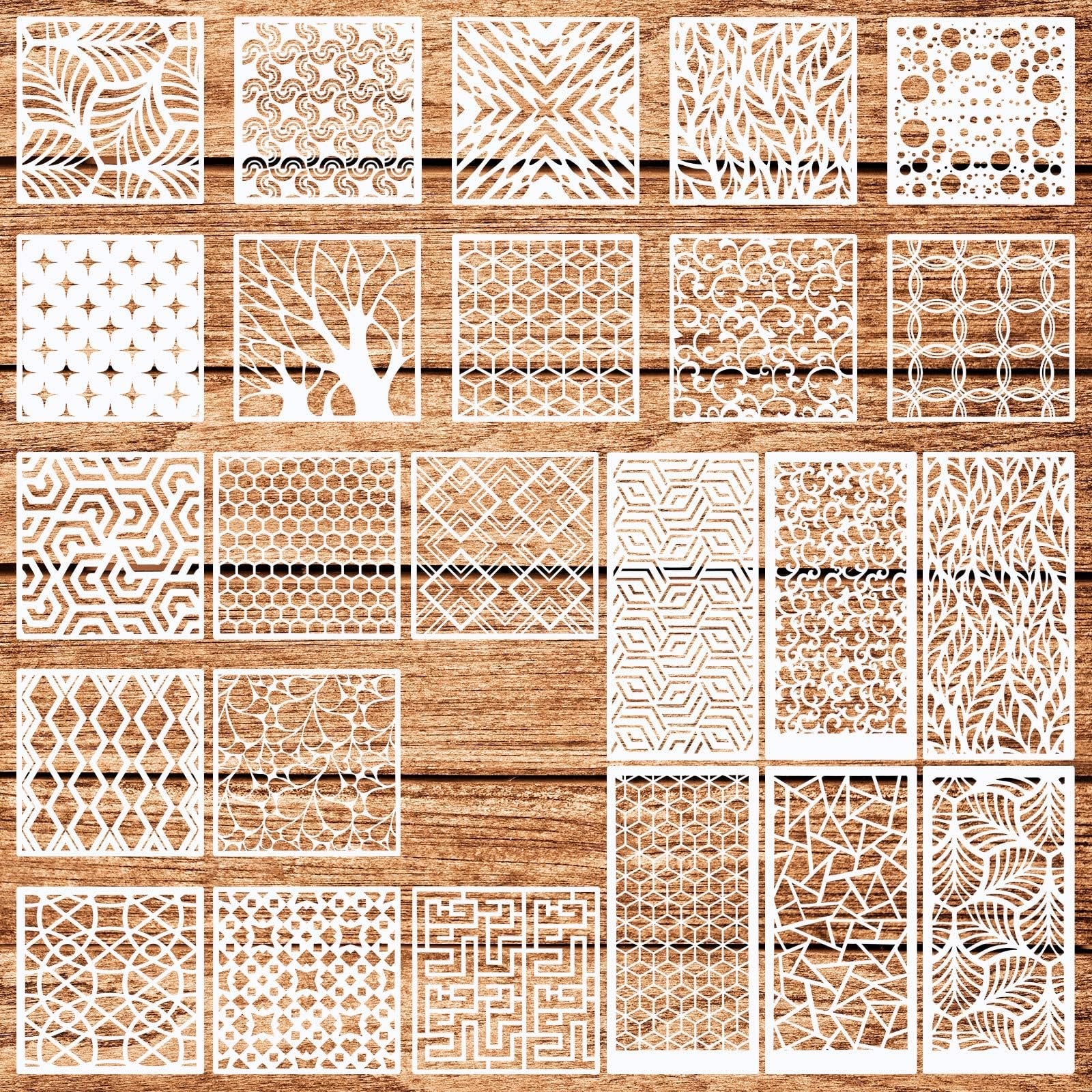 Collection of 24 reusable geometric stencils with various patterns laid out on a wooden background.
