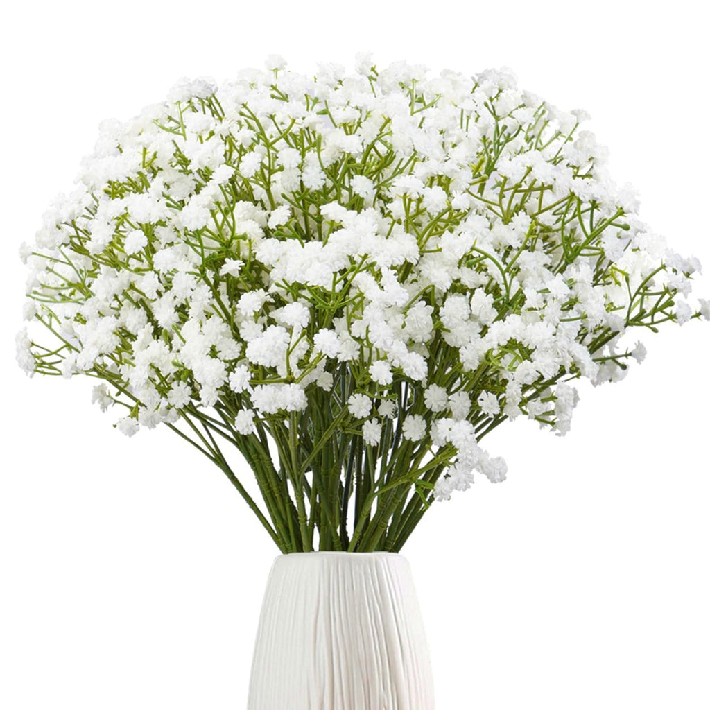 Bunch of white artificial baby's breath flowers in a white vase against a white background