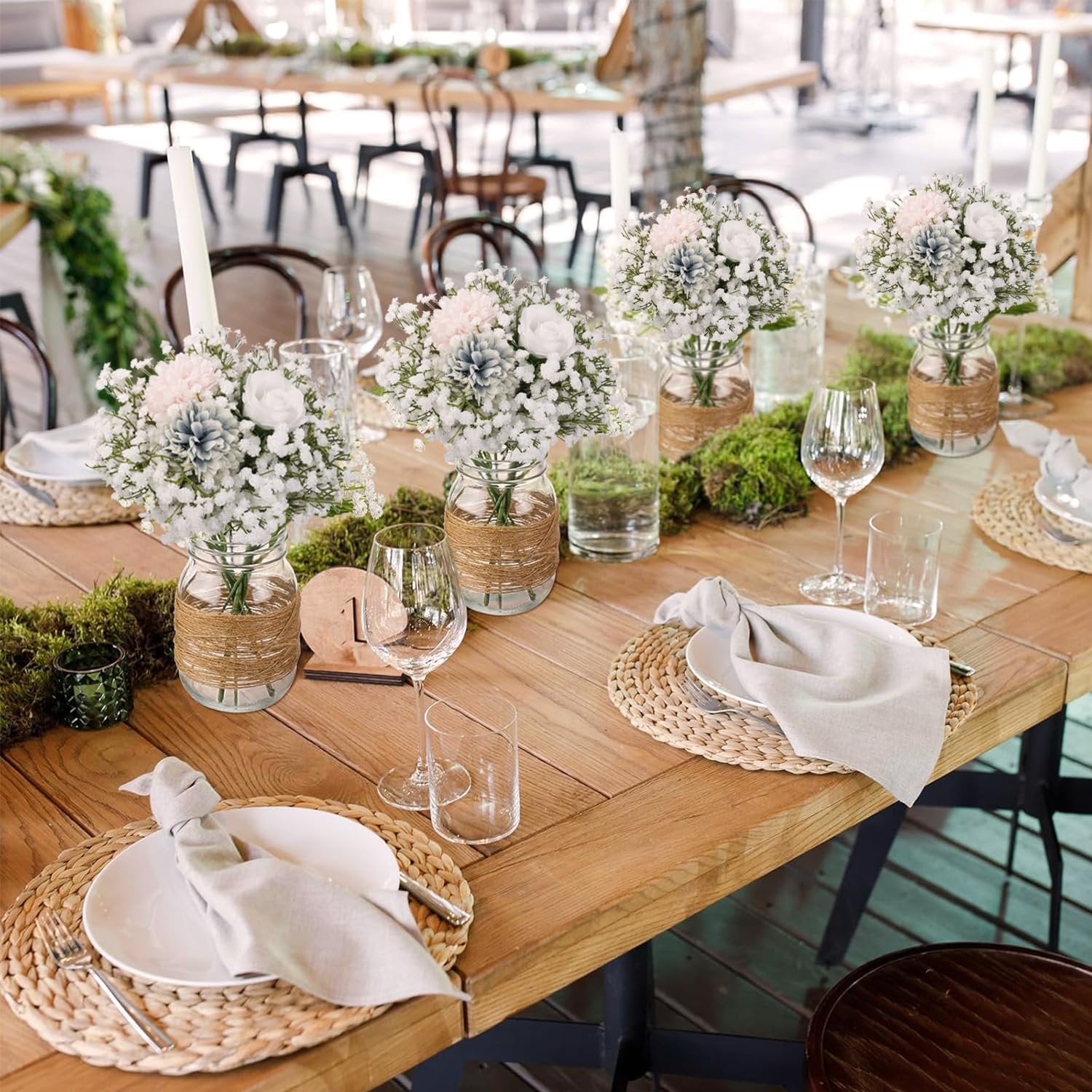 Table setting with floral arrangements and place settings for a wedding reception