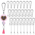 Silver metal keychain bars with snap hooks and one decorative keychain with 'TEACH' text and pink tassel
